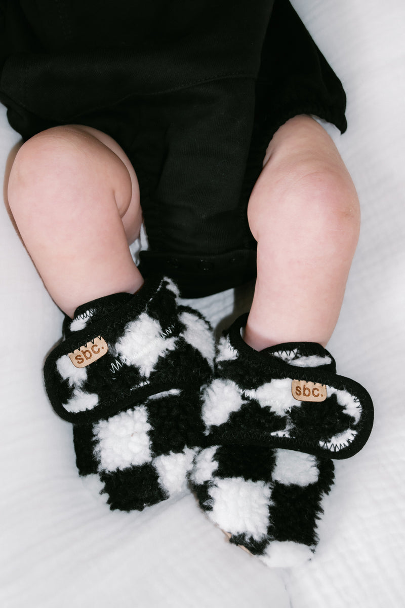 The Newborn Sherpa Bootie — Black + White Checkered